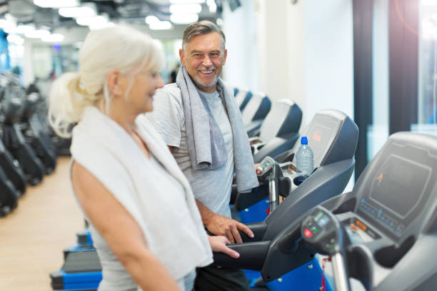 istock Senior couple in gym 667426396