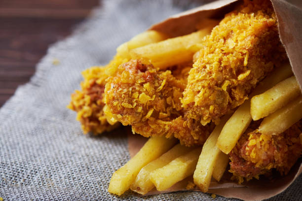 istock Fried Chicken breast on an old rustic wooden background 667427256