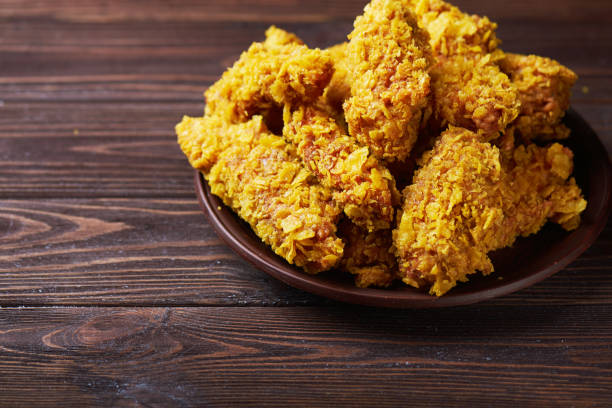 istock Fried Chicken breast on an old rustic wooden background 667427866
