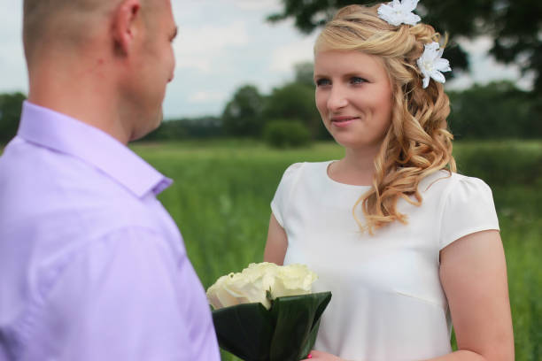 istock Couple lovers walking in field in summer day 667431350