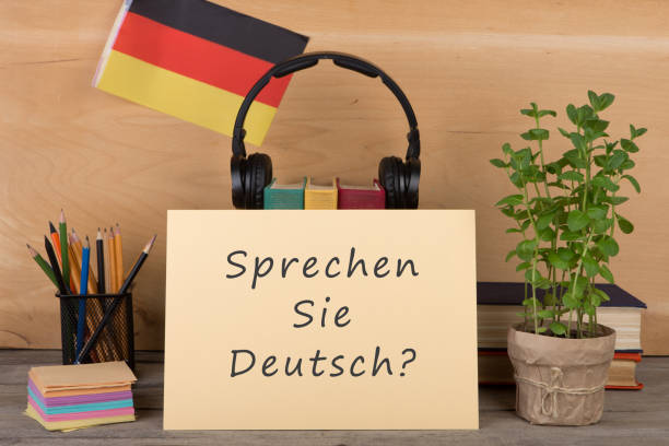 papel con texto "sprechen sie deutsch?", bandera de la alemania - alemán fotografías e imágenes de stock