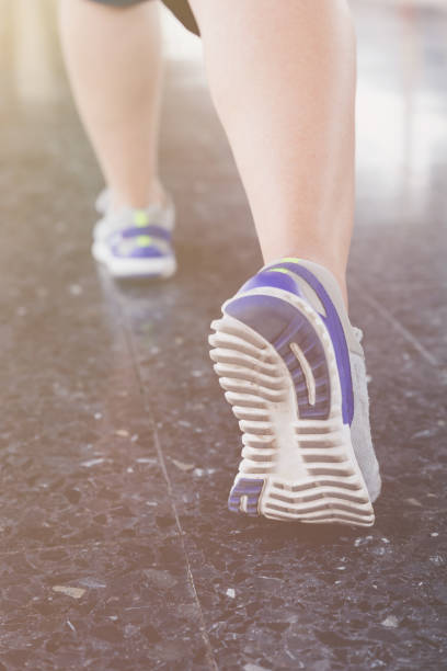 istock Young woman run on the station platform with backpack on train station 667442188