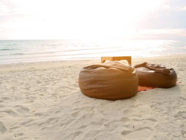 Bean bags and table set on the beach