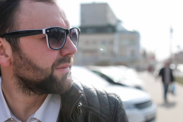 handsome and attractive person in the summer in the landscape of city streets and parks