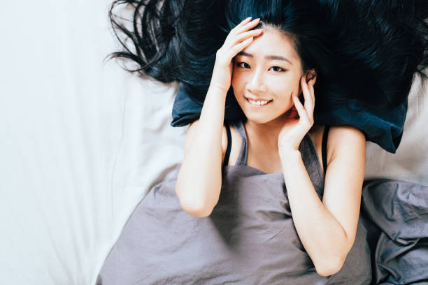 istock Young Woman in Bed 667446532