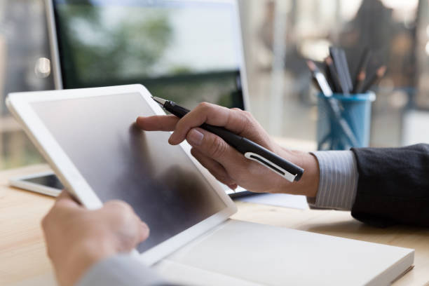 istock businessman watching something on digital tablet in office 667449988
