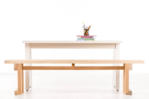 istock Desk with books and school supplies 667450056