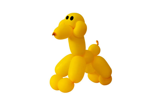 istock Twisted yellow balloons are dog shaped on white background 667450174