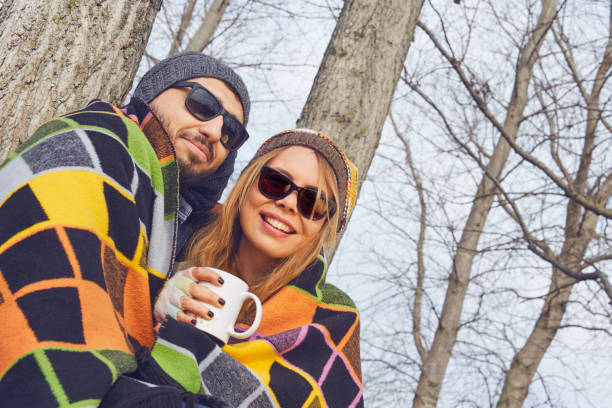 istock Couples celebrating birthday party in winter 667451094
