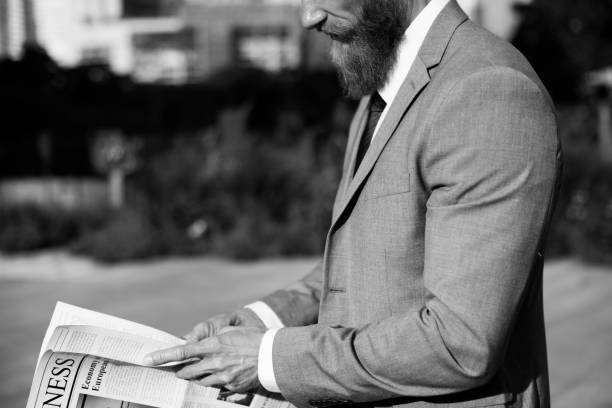 istock Businessmen Hands Hold Newspaper News 667457780