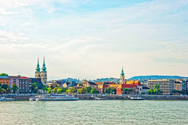istock Ferry and Buda City with University Church Spire at Danube 667458016