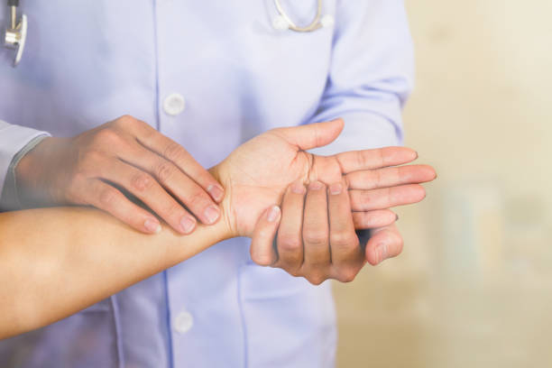 istock Doctor hands feeling pulse on female wrist 667458022