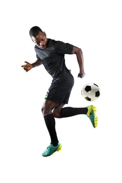 istock African American Soccer player Performing Back Kick 667458726