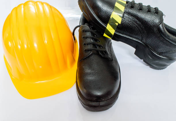 istock Safety shoes and helmet 667461004
