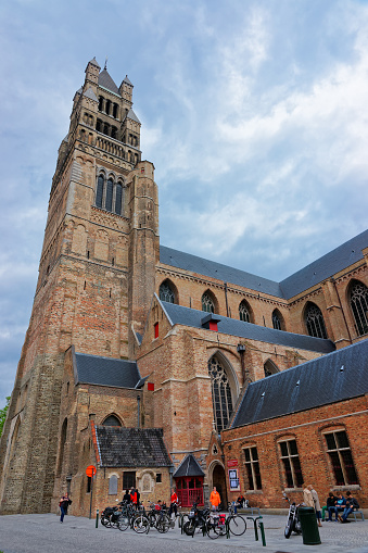 Brugge, Belgium - May 10, 2012: St Salvator Cathedral in the medieval old city of Brugge, Belgium. People on the background