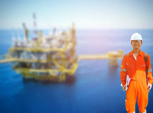 istock Working engineer at offshore oil and gas refinery 667465478