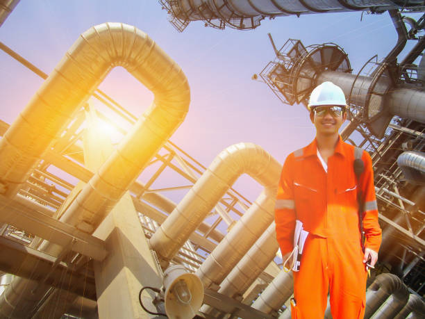 istock Working engineer at offshore oil and gas refinery 667465526