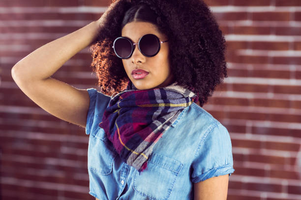 istock Attractive young woman wearing sunglasses 667465790
