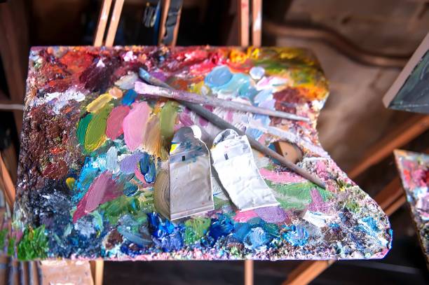 istock Palette with artists brushes and oil paints 667467038