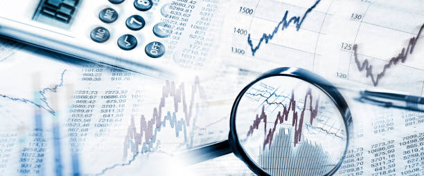 istock Stock Quotes with magnifier and calculator 667477616