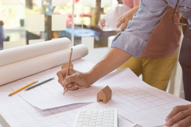 istock Architect or engineer meeting, working with blueprints in office, Construction concept. 667477660