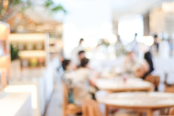 istock Blurred background : blur group of people at restaurant with bokeh light background 667485312