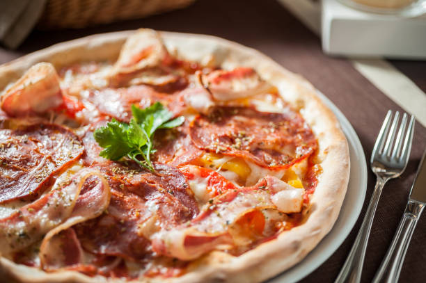 istock Italian salami and bacon pizza with cheese 667486360