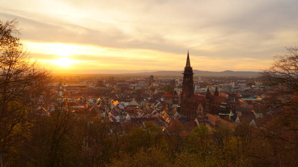 Evening atmosphere over Freiburg im Breisgau from Kanonenplatz Romantic view of the city of Freiburg im Breisgau. Taken from Kanonenplatz above the city, in romantic, spring-like light in March. bonn germany stock pictures, royalty-free photos & images