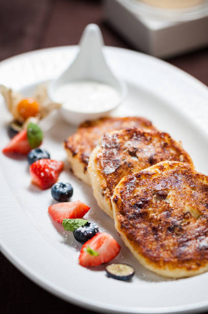 istock Cottage cheese fritters with berries 667491180