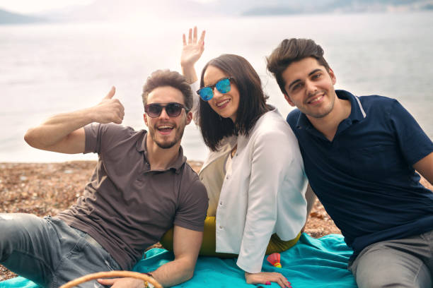 istock Three friends having fun at the beach 667491224