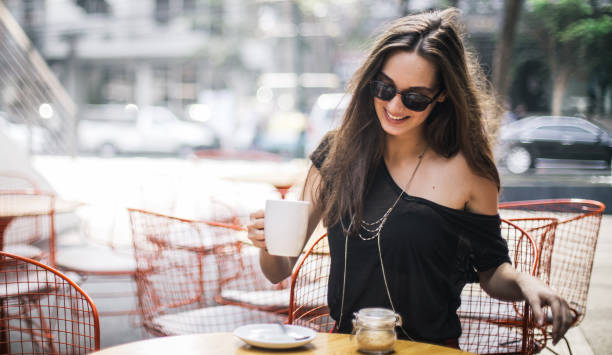 istock Woman in cafe drinking tea 667491580