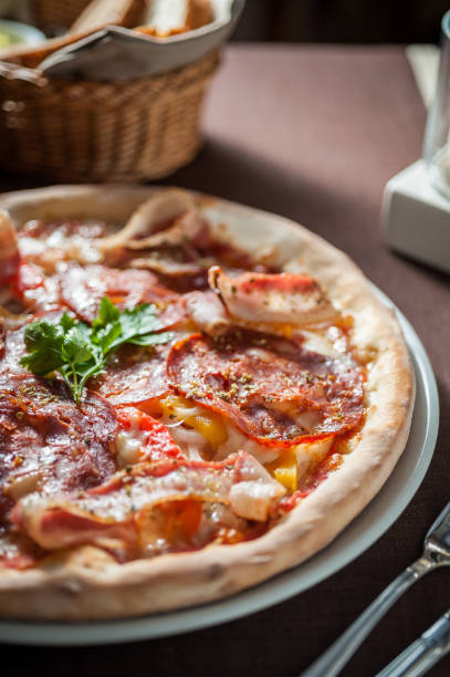 istock Italian salami and bacon pizza with cheese 667494938