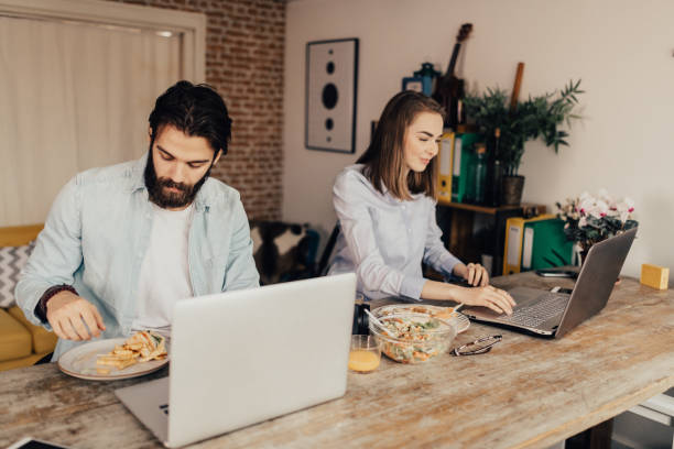 istock Happy couple have grabbed a snack while they were studying at home 667496010