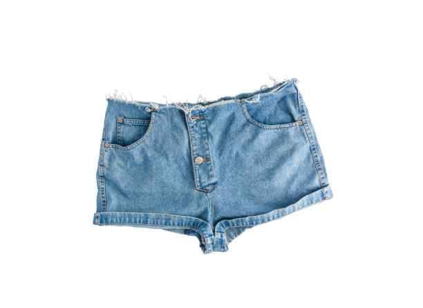 istock Denim short shorts with torn edge, isolated on white background 667499808