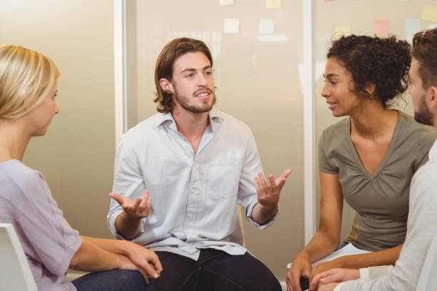 istock Businessman talking to colleagues 667501990