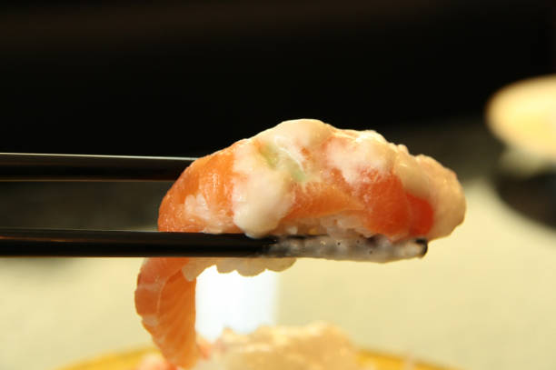 istock Shrimp sushi with chopsticks 667502704
