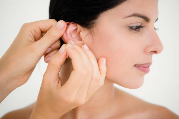 istock Pretty woman in an acupuncture therapy 667503400