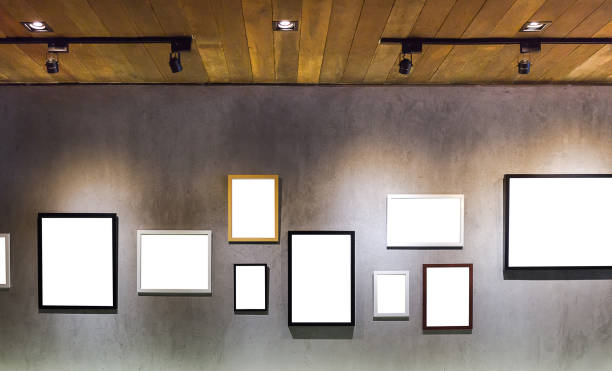 blank empty picture frame hanging on ceent wall blank empty picture frame hanging on ceent wall with light from wood roof in studio art museum photos stock pictures, royalty-free photos & images