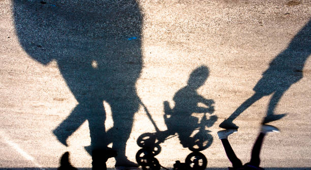 istock Blurry familly with kids silhouette and shadow 667507516