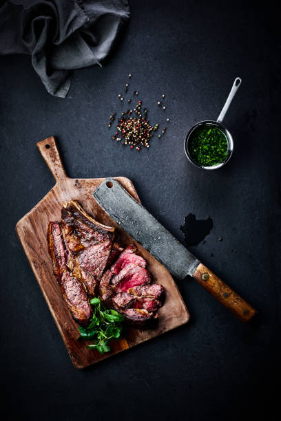 Roasted steak with peppercorns and peas Top view of roasted steak with peppercorns and peas roast beef photos stock pictures, royalty-free photos & images
