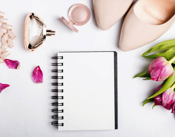istock Notepad with blank paper and beige color accessories on white ba 667510612