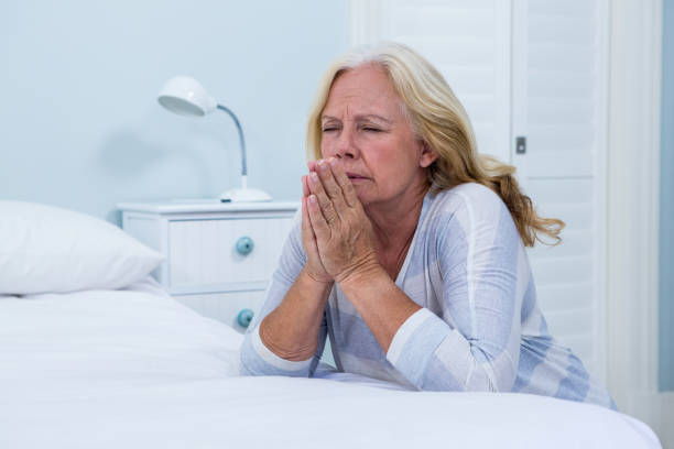 istock Woman praying in bedroom 667511248