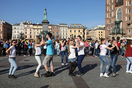 Cracow, Poland - April 1, 2017: the international Flashmob day of rueda de Casino, 57 countries , 160 cities. Several hundred persons dance Hispanic rhythms on the Main Square in Cracow