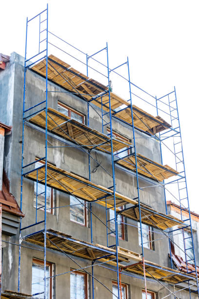istock construction site. scaffolding platforms for work on a new apartment building. 667536574