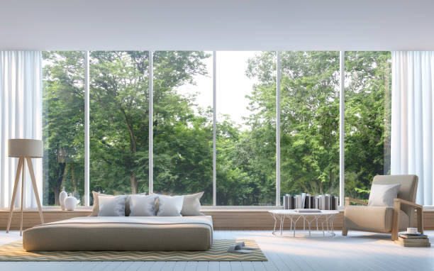 Modern bedroom with nature view 3d rendering Image Modern bedroom with nature view 3d rendering Image. There are large window overlooking the surrounding nature and forest bay window stock pictures, royalty-free photos & images