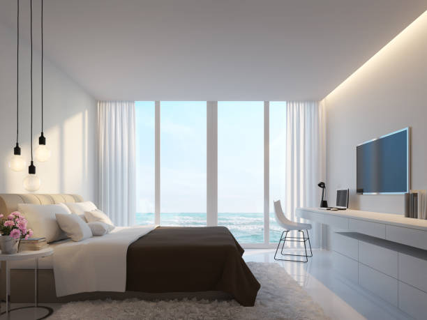 istock Modern white bedroom with sea view 3d rendering image 667536860