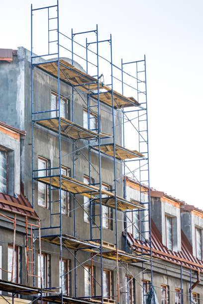 istock apartment building under construction. scaffolding on building wall. 667541100
