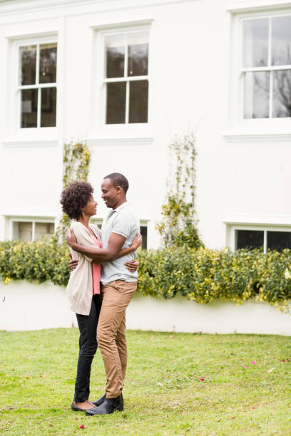 istock Smiling couple looking back at the camera 667542238