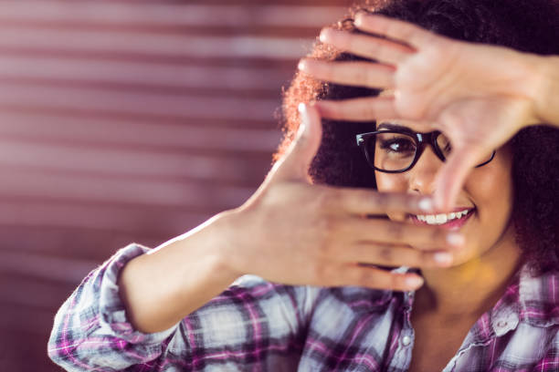 istock Attractive hipster taking picture with hands 667542376