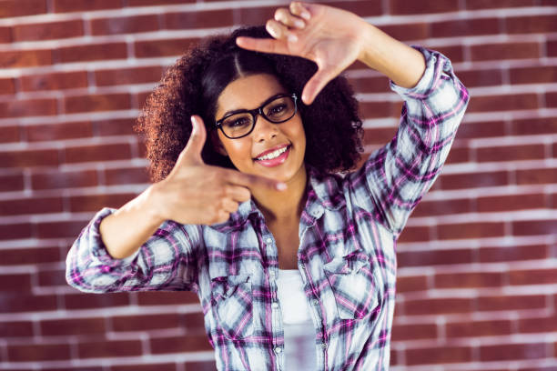 istock Attractive hipster taking picture with hands 667542590